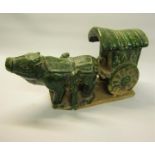 A Chinese green glazed ox cart, 30cm w, 16cm h.