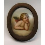 A 19c oval portrait miniature of a young angel in deep thought, on a ceramic plaque, framed, 8.5cm x