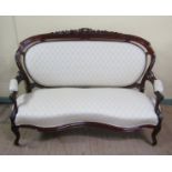 A pair of 19c style serpentine two seater sofas with upholstered back panels and seats within carved