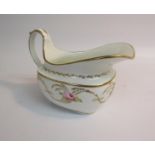 A Swansea porcelain creamer painted with flowers and gilt leafy fronds within gilt line borders,