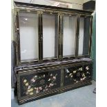 A contemporary black lacquered chinoiserie floral decorated library bookcase, the upper shelved