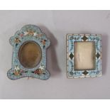 A micro mosaic miniature photo frame decorated with flowers on blue background, together with one
