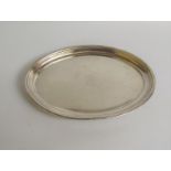 A George IV silver oval dish with a raised shaped border, London 1821, 17cm w.