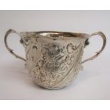 A 19c two handled loving cup, half writhen embossed and chased with flowers, marks rubbed, 14cm w.