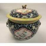 A 19c Oriental tureen and cover decorated with panels of finches amongst blue leafy background,