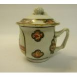 A 19c Chinese cup and cover, the cup with entwined handle and having a lift off cover with fruit