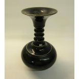 A 19c Oriental famille noire pottery bottle vase of compressed baluster form with a four ring long