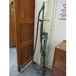 A Gilbert & Barker Manufacturing Co spring filled Massachusetts hand cranked petrol pump, 200cm h.