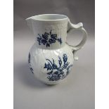 A late 18c Worcester cabbage leaf mask jug with floral transfer decoration, crescent mark to base,