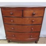A mid Victorian mahogany bow front chest of two short and three long graduated drawers, all with