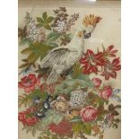 A Victorian needlework of a parrot composed of stumpwork perched within a bouquet of flowers and