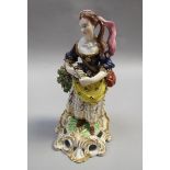 A Derby figure of a lady playing a triangle (one of a pair of the Flambe Musicians), slightly a/f,