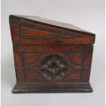 A Victorian oak letter box with hinged sloping cover, carved in a Gothic style, 29cm w, 18cm h.