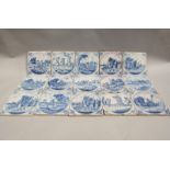 A set of fifteen 18c blue and white Delft tiles painted with Dutch scenes of rural life and