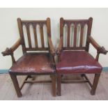 A pair of 19c oak open armchairs with Gothic arched and carved back panels, the arms with boar