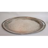 An Edwardian two handled oval tea tray with a raised gadroon border, makers mark for Walker &