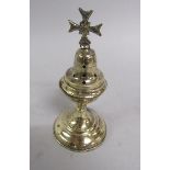 A late 18c/early 19c bronze Ciborium with hinged pierced cover and scrolling handle on a circular