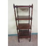 An early 19c rosewood four tier whatnot with base drawer of rectangular form with ring turned