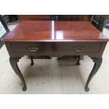 A 19c mahogany side table of rectangular form with moulded edge and rounded corners, fitted one long