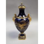 A Coalport vase and cover of dark blue ground, decorated with gilt flower sprays and having gilt