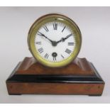 A late 19c walnut mantel clock with ebonised base moulding and drum head case. The movement no.85432