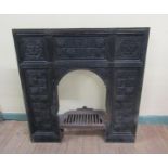 A 19c cast iron fire surround, the panels rosette decorated with leaf and flowers, manufactured by