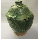 A Chinese Song Dynasty 10c/11c green glazed jar and cover with calligraphy to interior, possibly