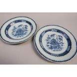 A pair of late 18c Delft plates painted with willow trees, flowers and rocks, possibly London, rim