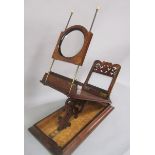 A large walnut stereoscope by Rowsell with glass and card views, 59cm w.