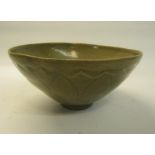 A Korean, late Goreo Dynasty 14c/15c celadon bowl with lotus petal moulding to the exterior, 17cm h.