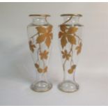 A pair of French Legras Art Nouveau period glass vases, gilt decorated with chestnut tree