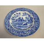 A soup plate printed with a scene of cattle watering in a river, two cottages on one back and a