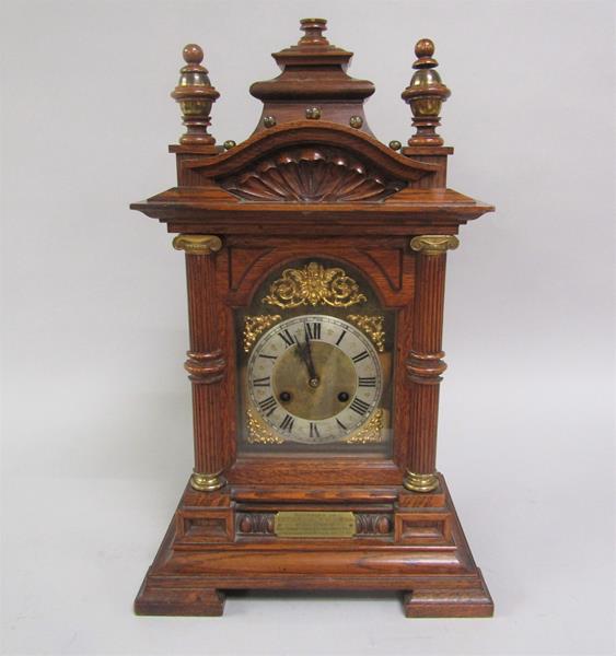 A late Victorian chiming mantel clock for Junghans movement with brass and silvered arched dial,