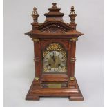 A late Victorian chiming mantel clock for Junghans movement with brass and silvered arched dial,
