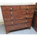 An early 19c figure mahogany chest of two short and four long graduated drawers, the rectangular top