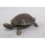 A late Victorian patinated steel tortoise clockwork automator desk bell operated by the head or