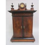 A late 19c cabinet polyphone (The Imperial) in a walnut veneered and ebonised cabinet, having a