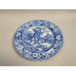 A blue and white plate printed with the 'Piping Shepherd' pattern, 25.5cm diam.