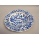 A blue and white soup plate transfer printed with the 'Chinese Market Stall' pattern, 24cm diam.