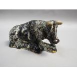 A 19c black glazed and gilt highlighted figure of a recumbent cow, probably Scottish, a/f 14cm h.