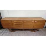 A 1970's Beithcraft Ltd teak sideboard fitted three cupboards, one with fall front, the others