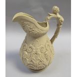 A 19c Drabware jug applied with Bacchus masks and handle, fruiting vine and scrolls, 23.5cm h.