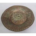 A 19c Oriental copper deep circular dish. The base decorated with a band of script, scrollwork and