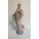 A Lladro porcelain figurine - Madonna with flowers, model no.5171, 33cm h.