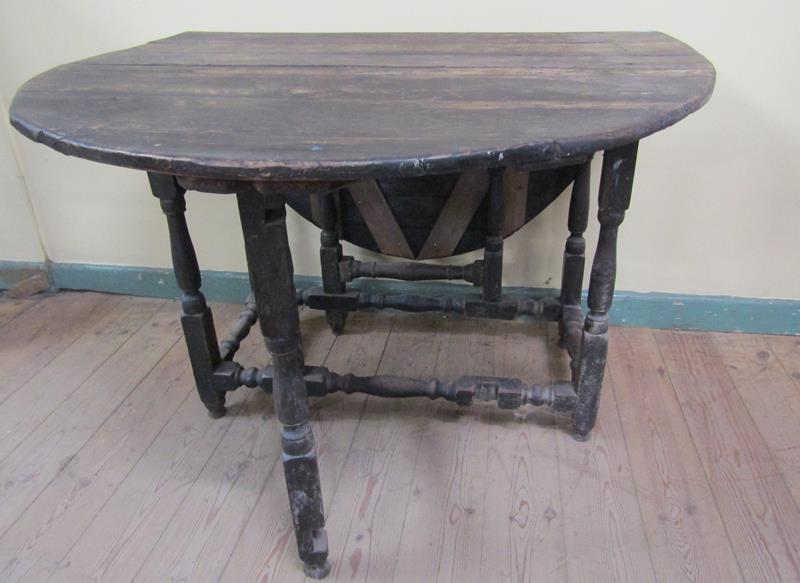 A late 17c/early 18c oak twin flap oval dining table on baluster turned supports - for - Image 4 of 4