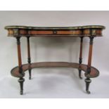 A rare 19c ladies kidney shaped writing table by Gillow of Lancaster. The top veneered with panels