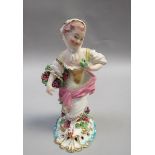 A patch marked Derby figure of a lady with a basket of grapes, supported on a pierced scroll base,