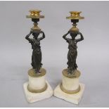 A pair of 19c bronze and marble candlesticks, the columns formed by bronze classical female
