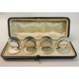 A boxed set of four Asprey menu card holders, makers mark for Samuel Mordon & Co, Chester 1906, in