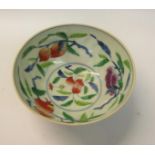 A Oriental porcelain bowl decorated with fruit and blossom with blue six character double circled